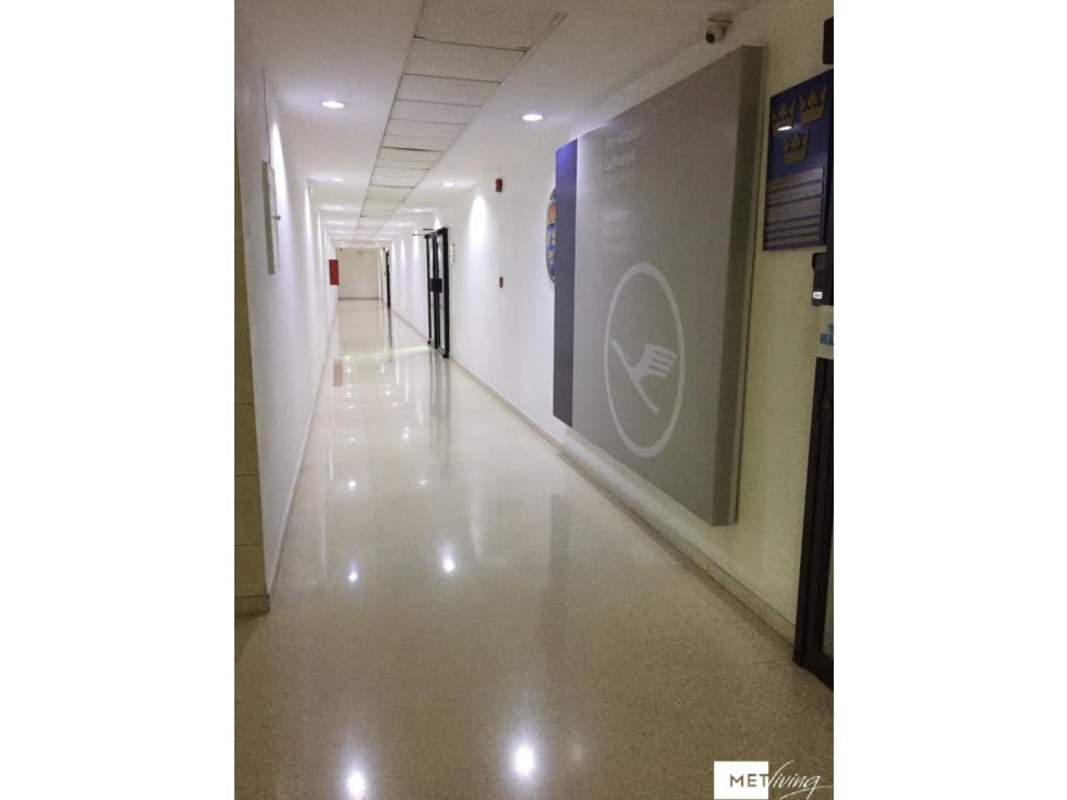 Modern hallway with polished floors, signage, security and lighting at PH BICSA tower Panama