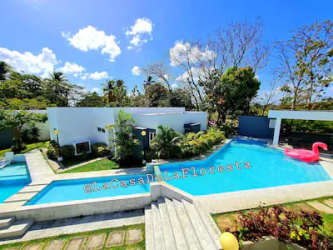 Modern swimming pool with tropical landscaping at Las Lajas beachfront gated community Panama