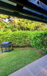 Cozy bedroom with garden view, tiled floor, window blinds in furnished beach home Las Lajas Panama