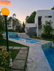 Clubhouse event hall with landscaped paths at Las Lajas Beach Residences Panama