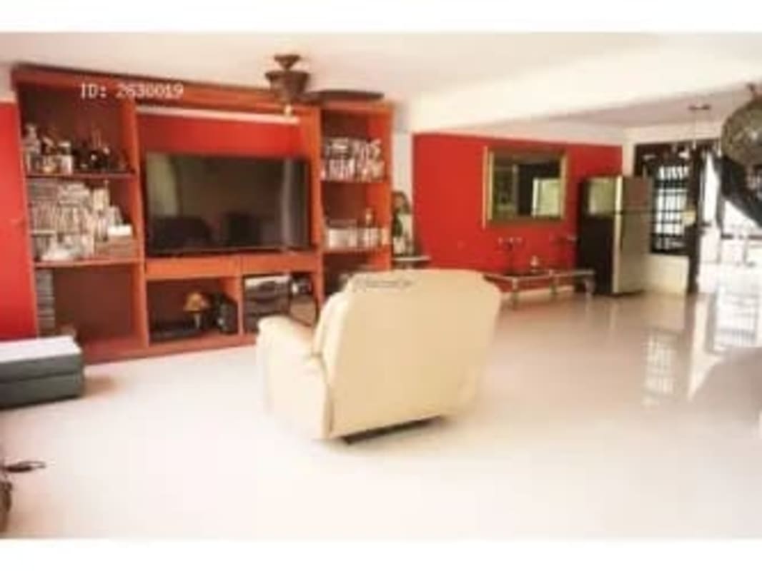 Dining area with arched doorways, wooden furniture, traditional style in Albrook Panama