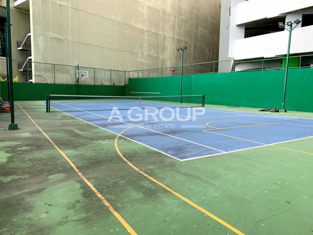 Modern kitchen featuring stainless steel appliances and panoramic window city view in PH Aqualina