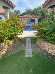 Landscaped pool garden with flowers tropical beach villa Punta Barco Panama