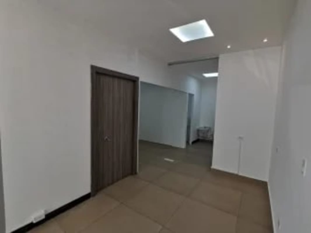 Private glass-walled office inside commercial unit PH Parque Mar Punta Paitilla Panama City