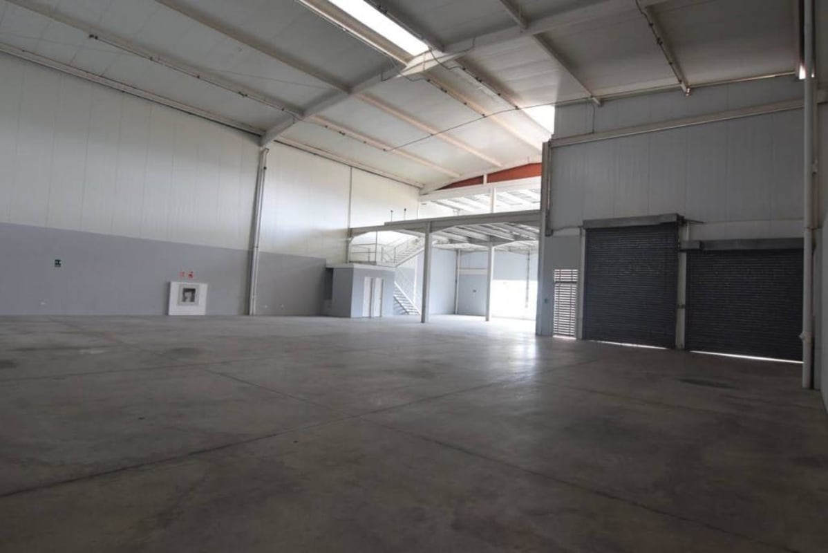 Clean empty warehouse space with mezzanine and concrete floor Pacora Panama