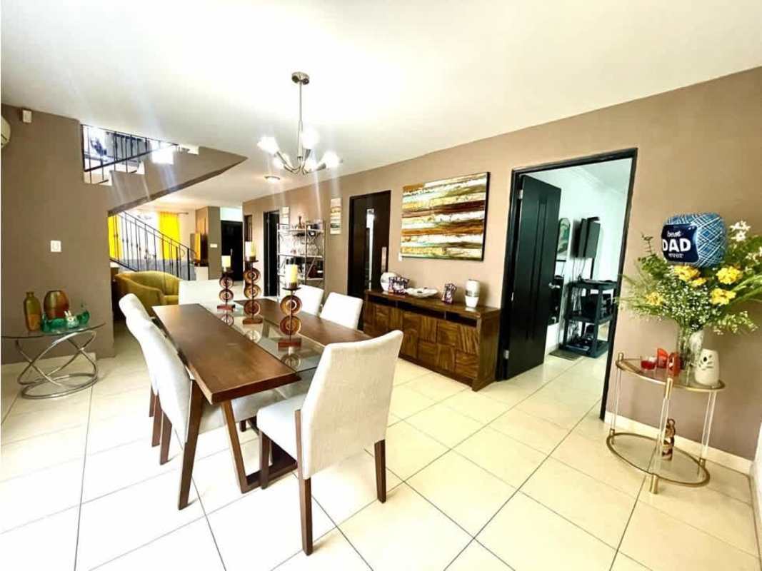 Covered terrace dining area with barbecue, garden and tiled floor in PH Paseo Dorado