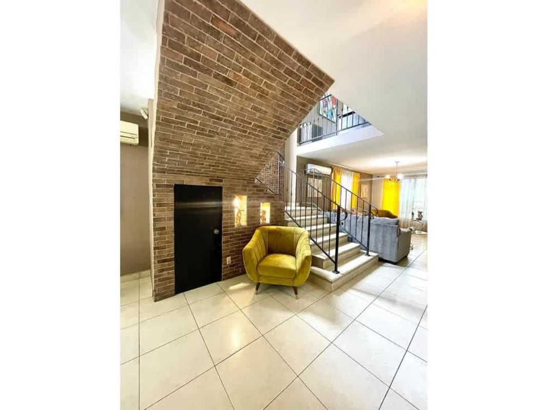 Dedicated home gym with weights, elliptical and exercise equipment in PH Paseo Dorado