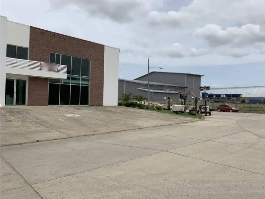 Industrial loading dock warehouse with container truck and large rolling door in Tocumen Panama