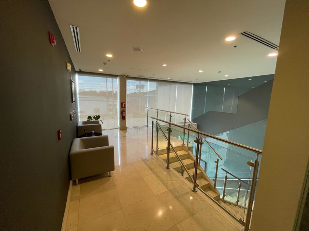 Modern lobby with staircase, seating area and windows at Panama office tower