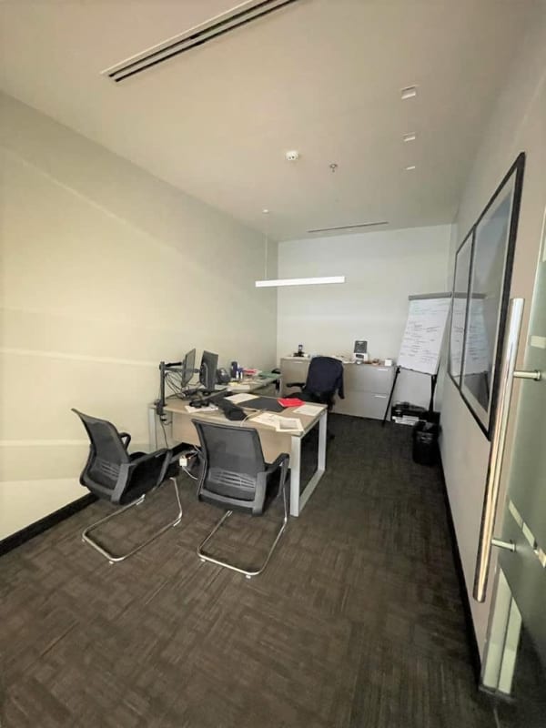Spacious minimalist office interior with desks, monitors, chairs in Panama