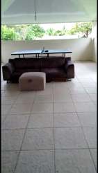 Covered recreation area with ping pong table, sofa, outdoor view in beach house Las Lajas San Carlos