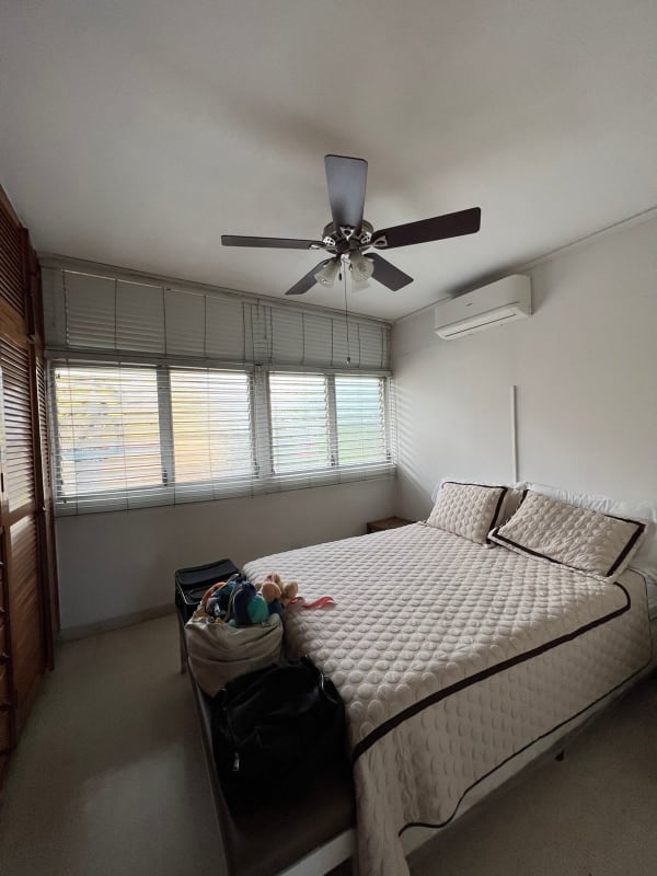 Bedroom with air conditioning, wood wardrobe and large windows Bella Vista house Panama