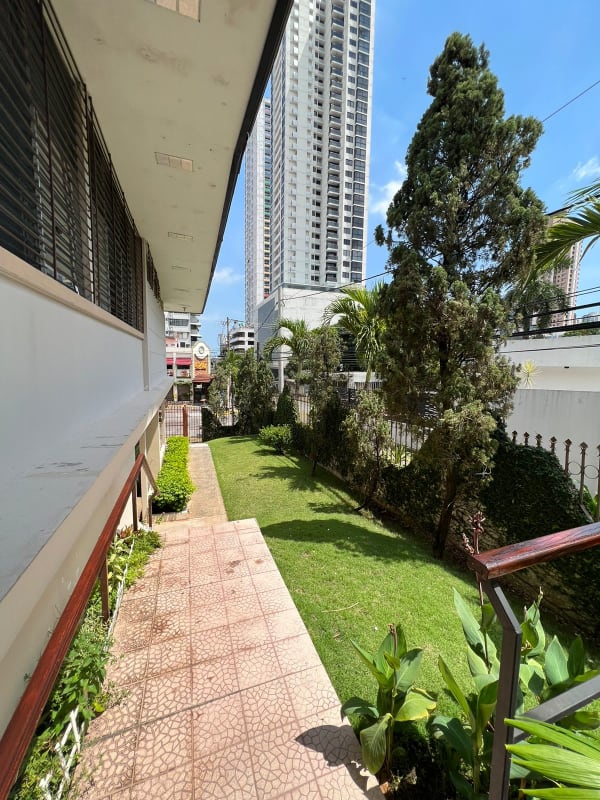 Private tropical style swimming pool with slide and terrace El Carmen house for sale Panama City