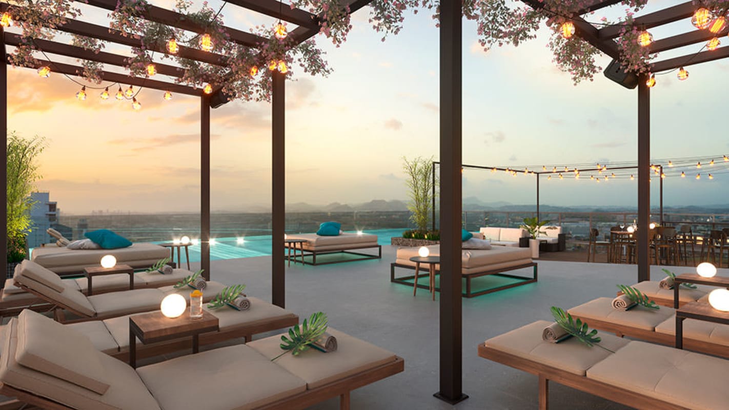 Open-plan studio layout with glass walls, city view, minimalist decor at PH Generation Tower Costa del Este Panama