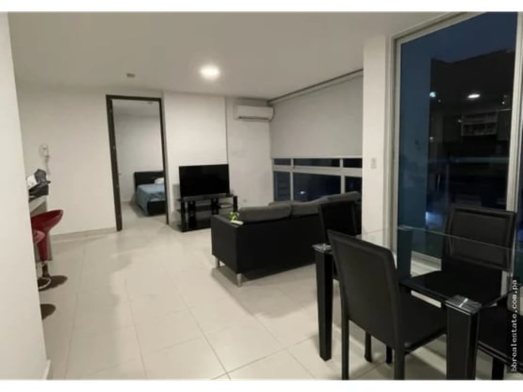 Apartment living dining room with night city view PH Miró El Cangrejo