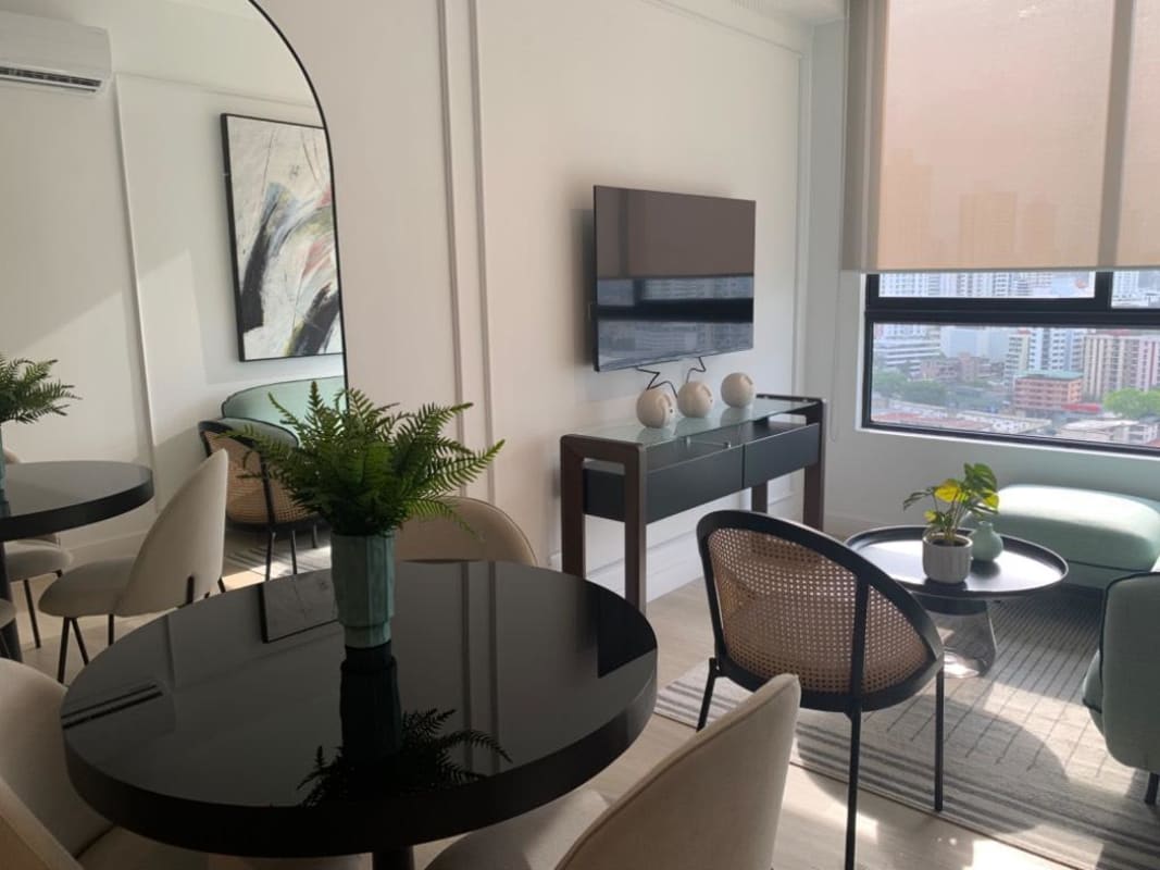 Open living and dining area with access to large terrace at PH Quatrium Carrasquilla