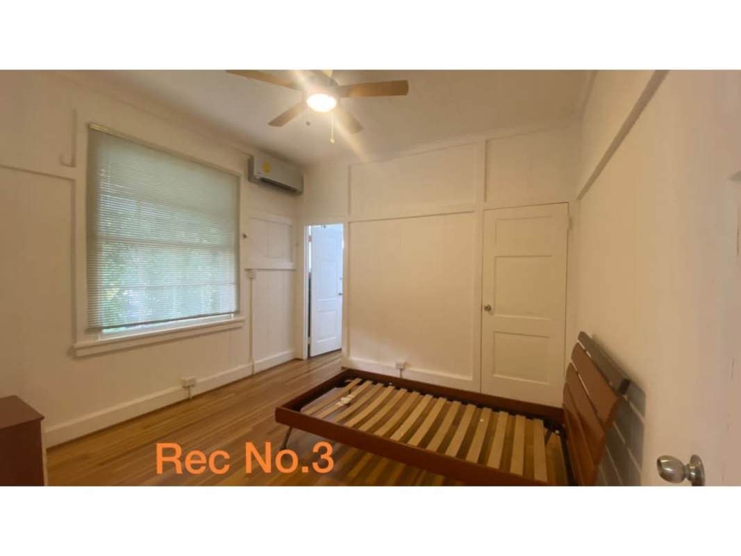 Bedroom wood flooring split AC inverter modern LED lighting in canal zone house Corozal Panama