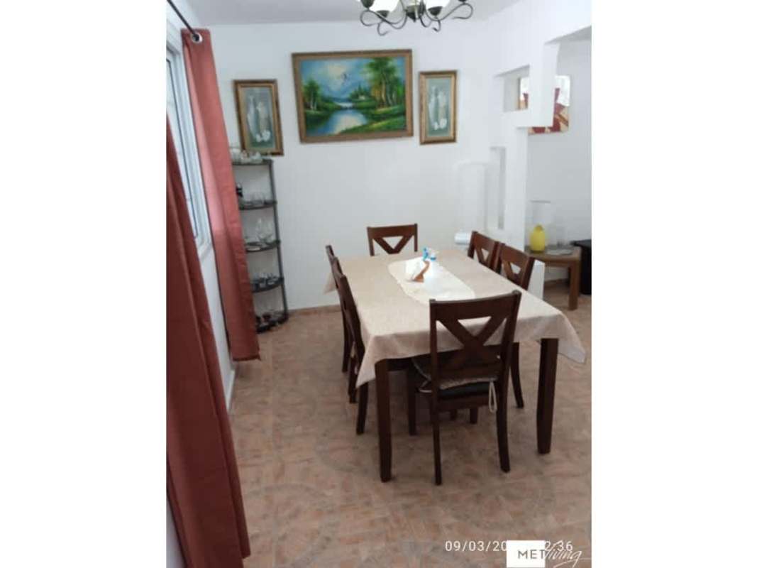 Bedroom with tiled floor, window curtains in house at Altos del Crisol Panama