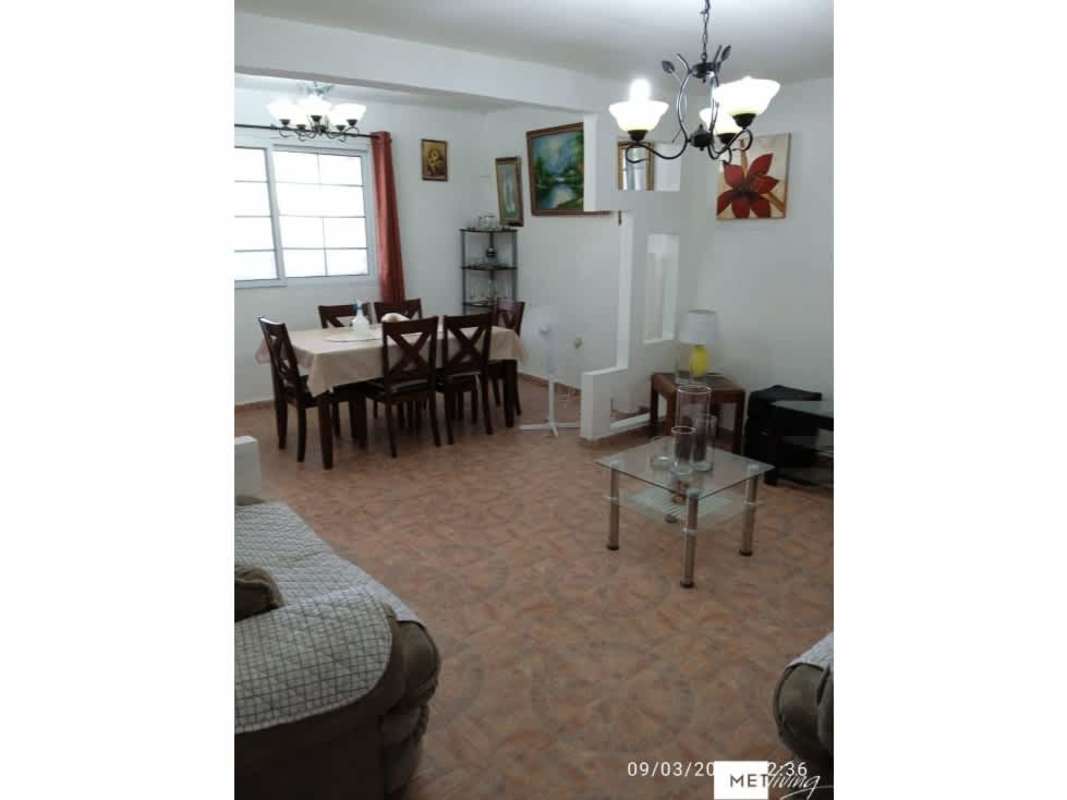 Bedroom with bed and security window bars in Altos del Crisol Panama