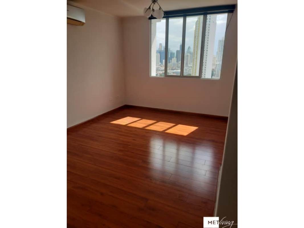 Bright bedroom with window cityscape view at PH Plaza Valencia Panama City