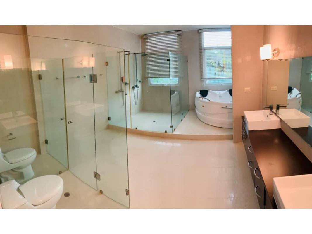 Spacious luxury bathroom with jacuzzi tub, glass shower, dual sinks in PH Costa Esmeralda Costa Sur Panama