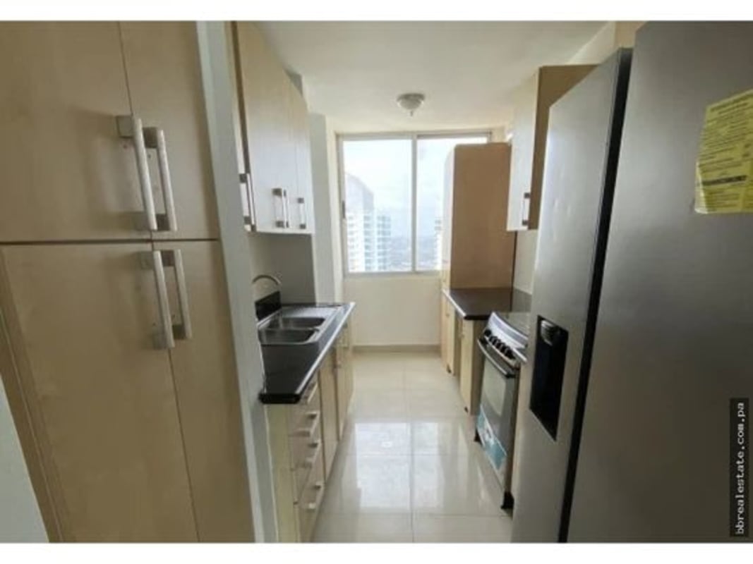 Modern walk-in closet with built-in shelves hanging rods bright space in PH Sevilla Costa del Este