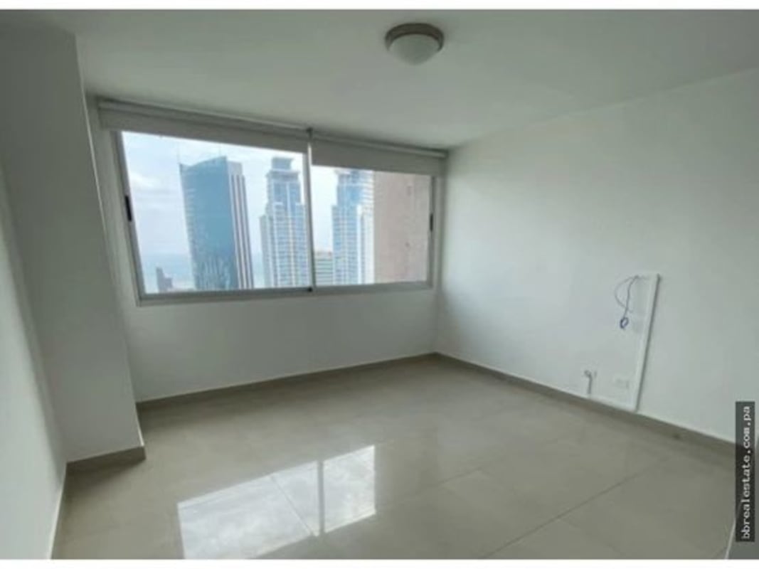 Modern bathroom with granite countertop glass shower enclosure large mirror in PH Sevilla Costa del Este Panama