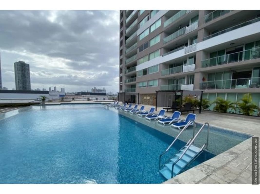 Spacious living area with panoramic ocean and city view via large windows in PH Sevilla Towers Panama