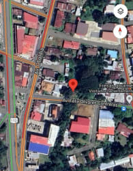 Aerial view of downtown David showing commercial buildings, roads and green areas in Chiriquí Panama