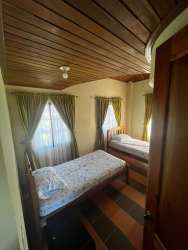 Contemporary bathroom with mosaic accent tiles, glass shower enclosure, Volcán Chiriquí Panama house