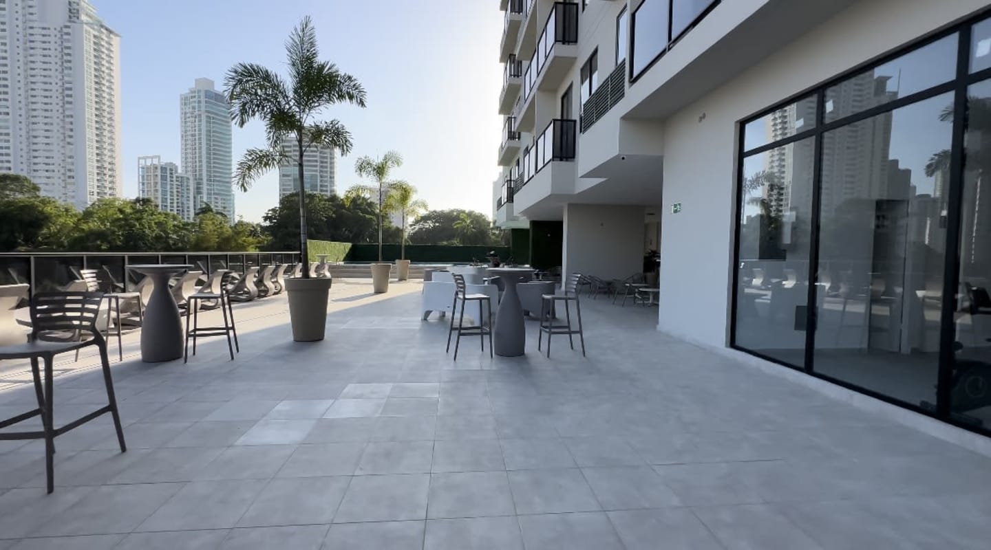 Rooftop infinity pool with lounge seating areas city skyline view PH The Gray Panama