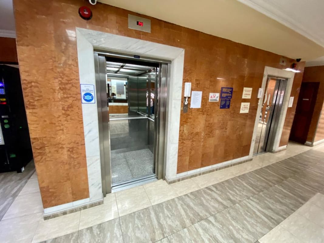 Lobby elevator hall with tiled walls in commercial hotel on Vía España