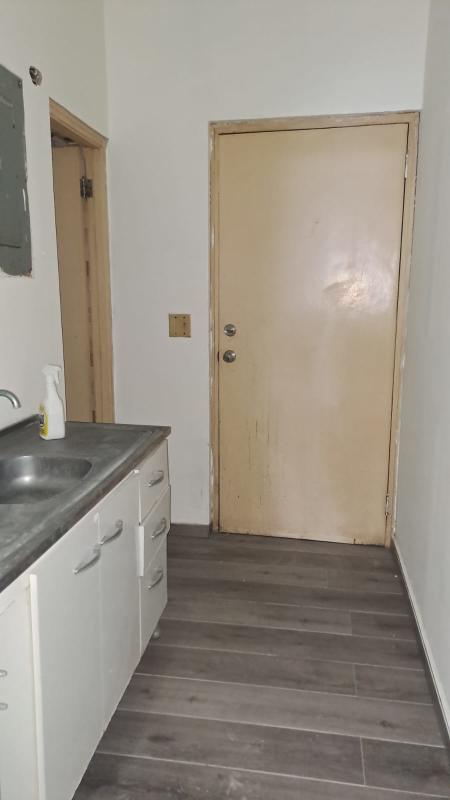 Modern commercial unit interior with vinyl flooring and grid ceiling Plaza Aventura Panama City