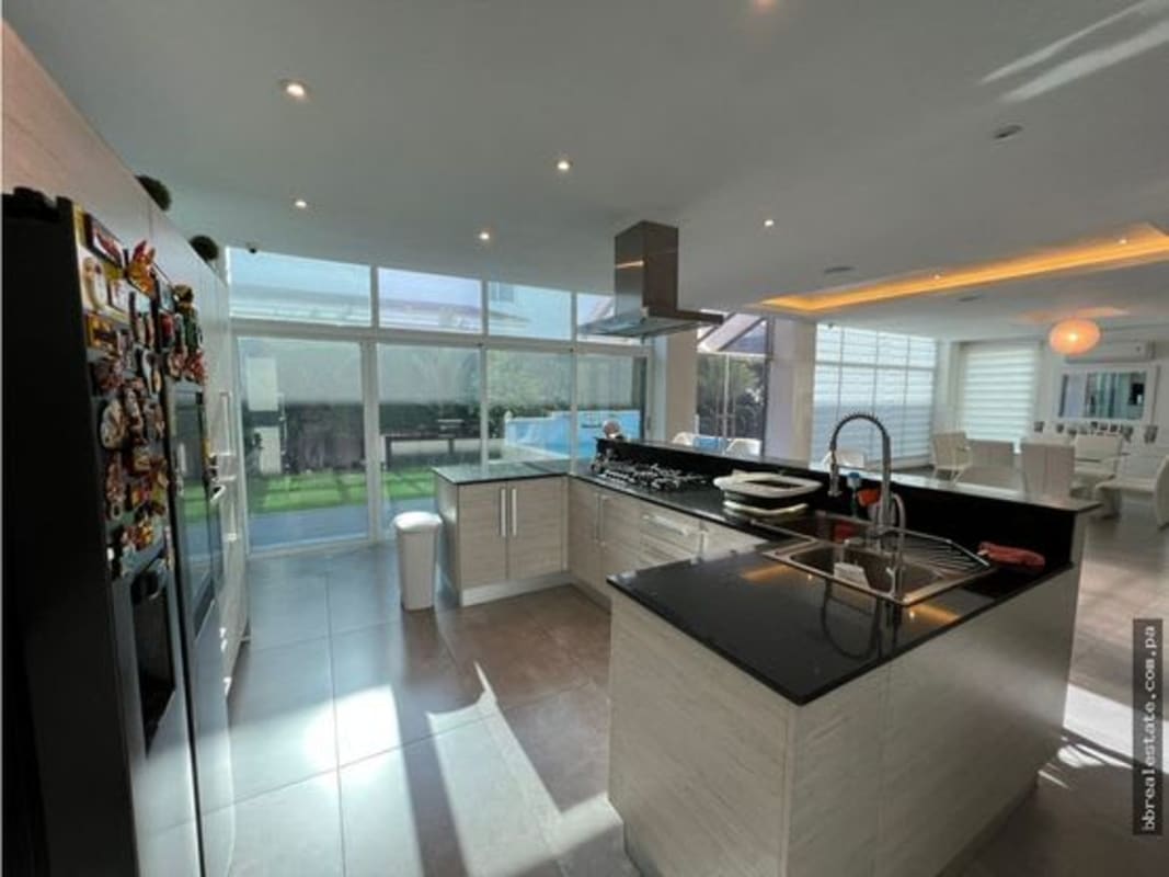 Living and dining area with large windows natural light access to terrace luxury house Altos de Panamá Panama