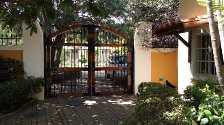 Mediterranean courtyard with garden, arches, lush landscaping in Villas de Coronado beach community Panama