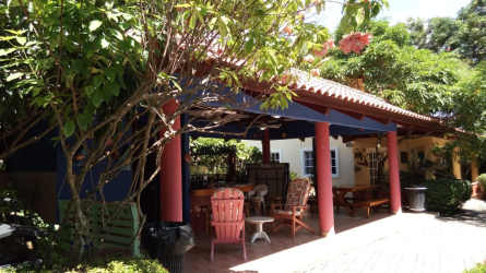 Landscaped tropical gardens with blooming plants around Mediterranean style villas in Coronado Panama