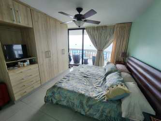 Master bedroom with large sliding door to oceanfront balcony Coronado Beach Panama