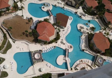 Multiple lagoon resort pools palm trees luxury beachfront Coronado Panama