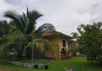 Lush tropical garden with palm trees and yellow villa Coronado Panama