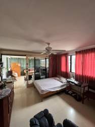 Integrated home office with bookshelves and natural lighting