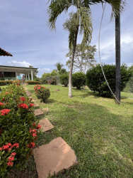 Kitchen area with large windows, cabinets, table Casa Chitré