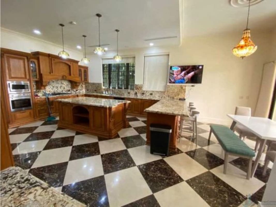 Outdoor patio with pergola, pool, jacuzzi overlooking lake in Island Estates Santa Maria Panama