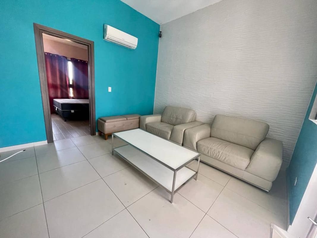 Bright bedroom with floor-to-ceiling windows and ocean view at PH Rivage Punta Pacifica