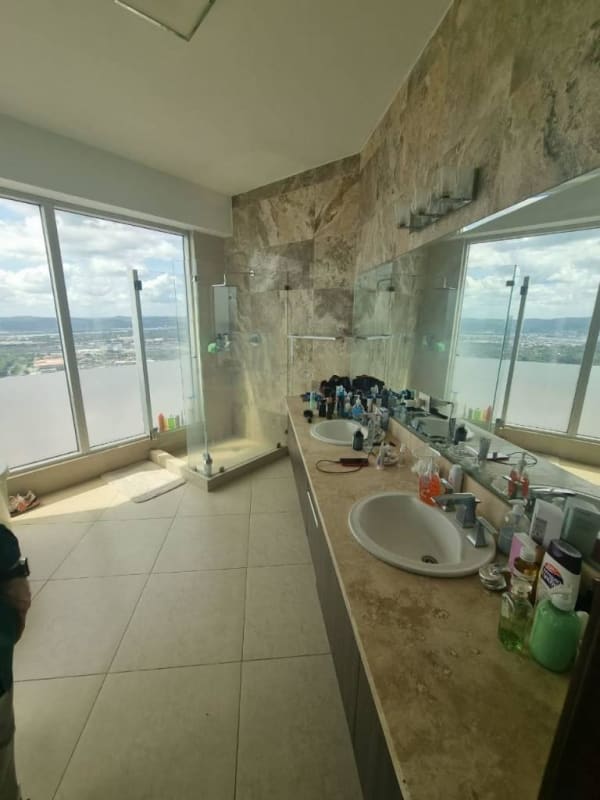 Luxurious bathroom with soaking tub, double sinks and ocean view in PH Rivage