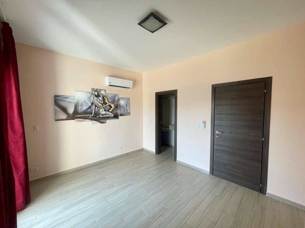 Bedroom with air conditioning large window closet space Costa Sur house Panama