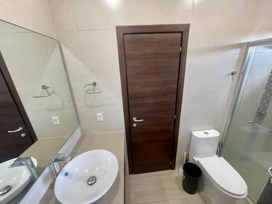 Bathroom with glass shower vessel sink mirror Costa Sur house Panama