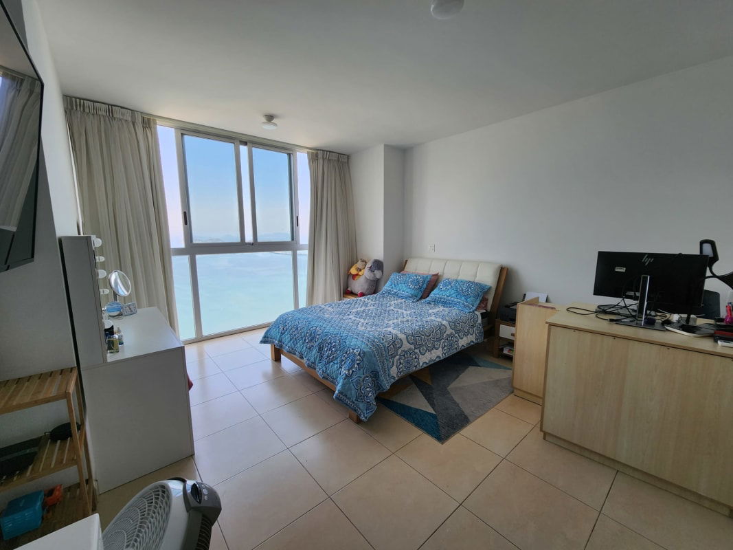 Spacious master bedroom with Pacific Ocean view windows in PH Waters on the Bay Panama