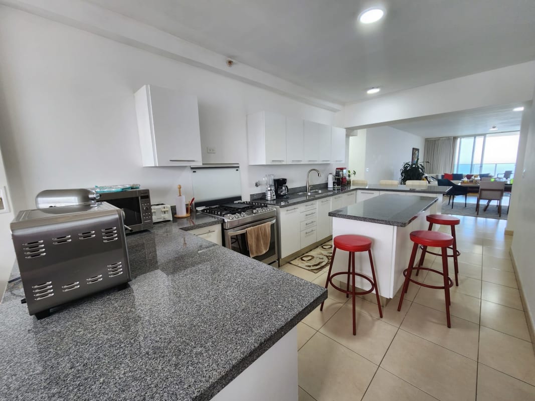 Minimalist bathroom with granite vanity sink and shower in Waters on the Bay Panama