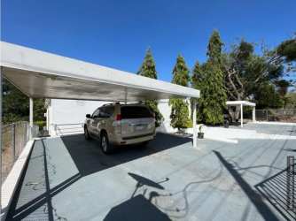 Front view gated modern beach house Coronado Panama for sale by Hola Realty