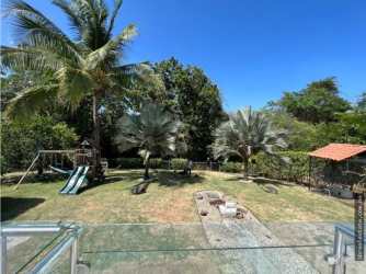 Front driveway secure metal fence minimalist beach house Coronado for sale